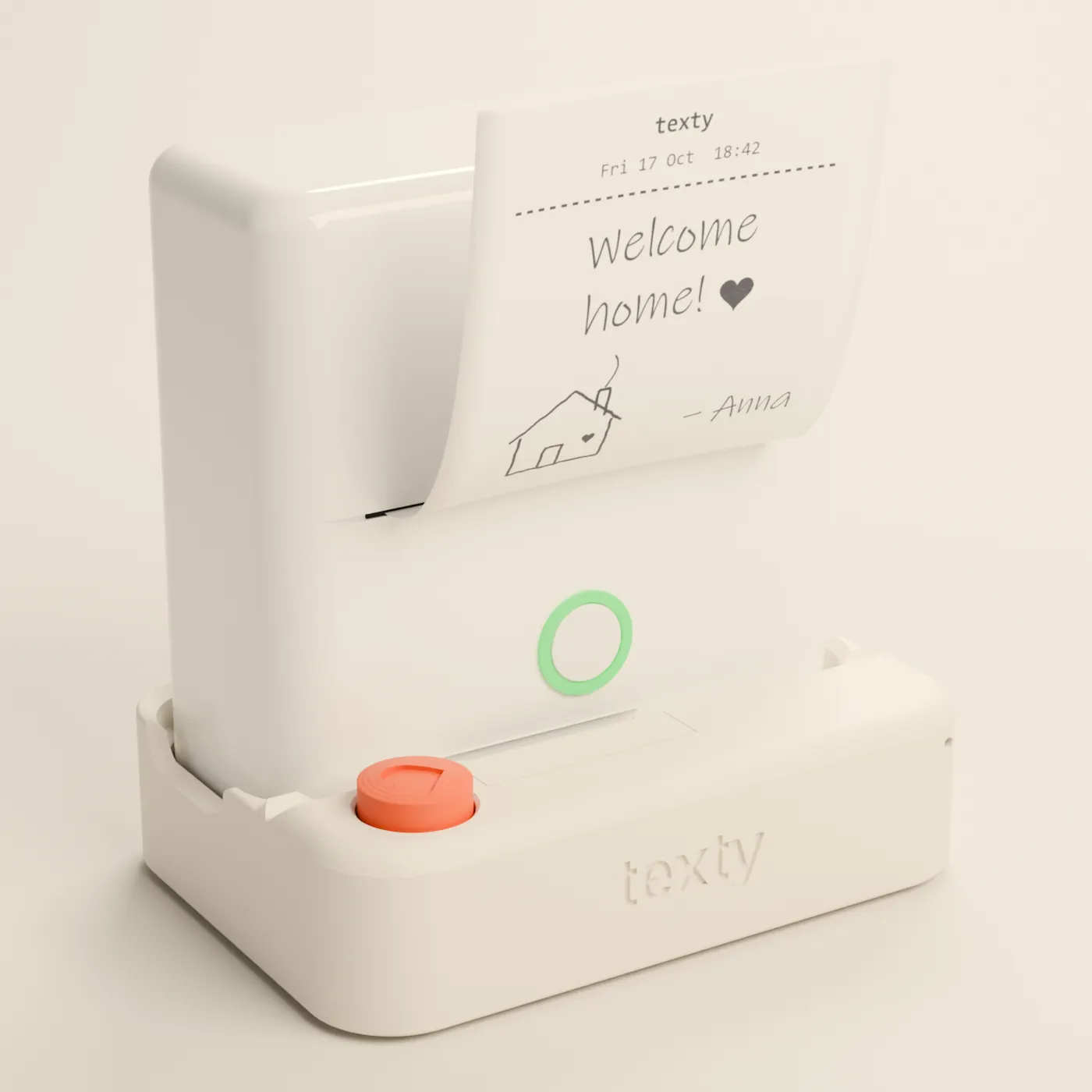A Texty on a table: a small white printer on its dock with a red heart button. A note saying “Welcome home!” with a doodled house, signed Anna, sticks out of it.
